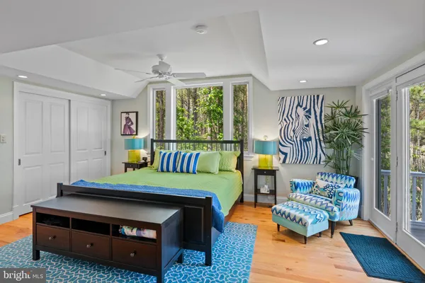 a view of a livingroom with furniture and hardwood floor