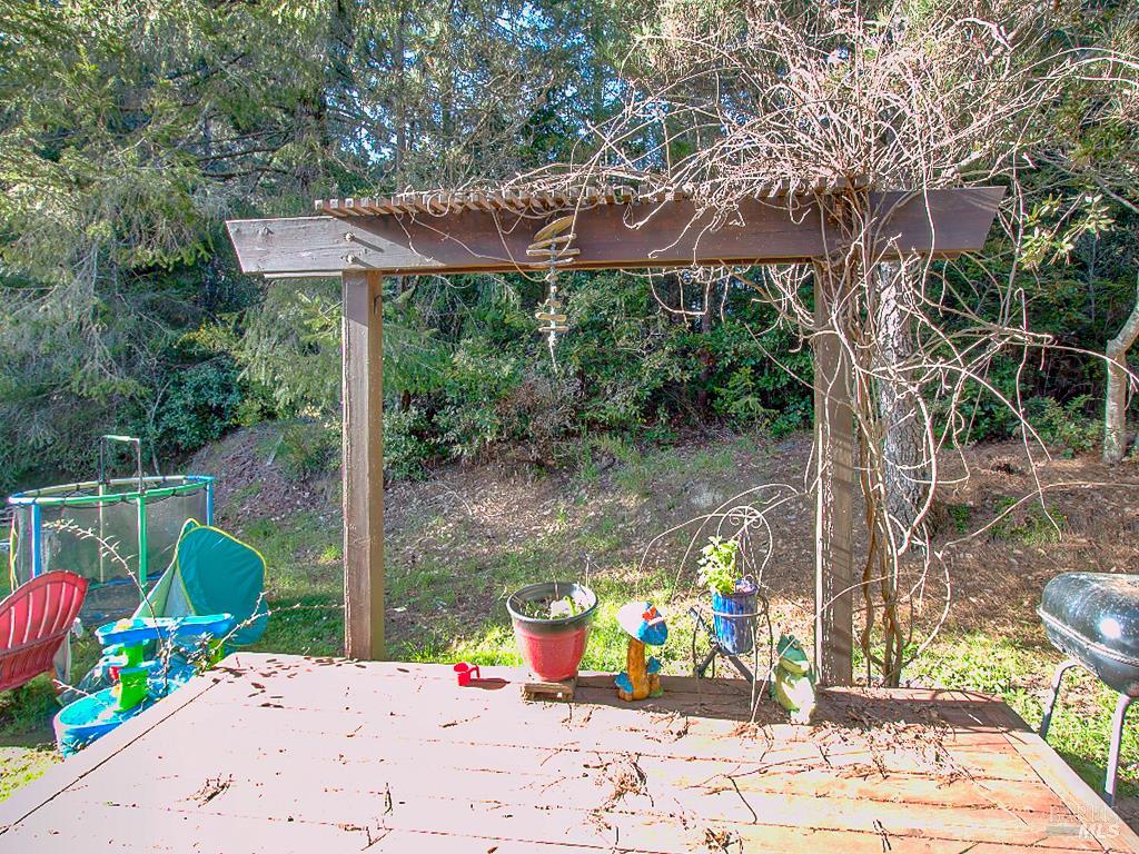31191 Turner Road Fort Bragg, CA 95437 - Photo 16 of 36 a view of a patio with table and chairs potted plants