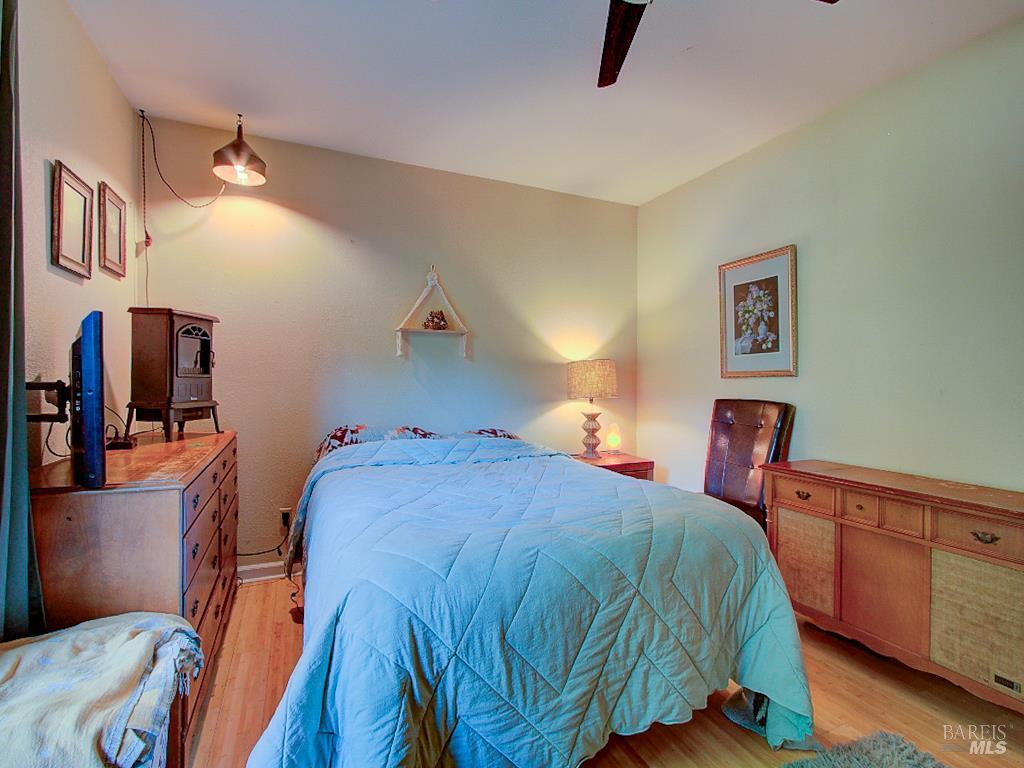 31191 Turner Road Fort Bragg, CA 95437 - Photo 23 of 36 a bedroom with a bed and a dresser