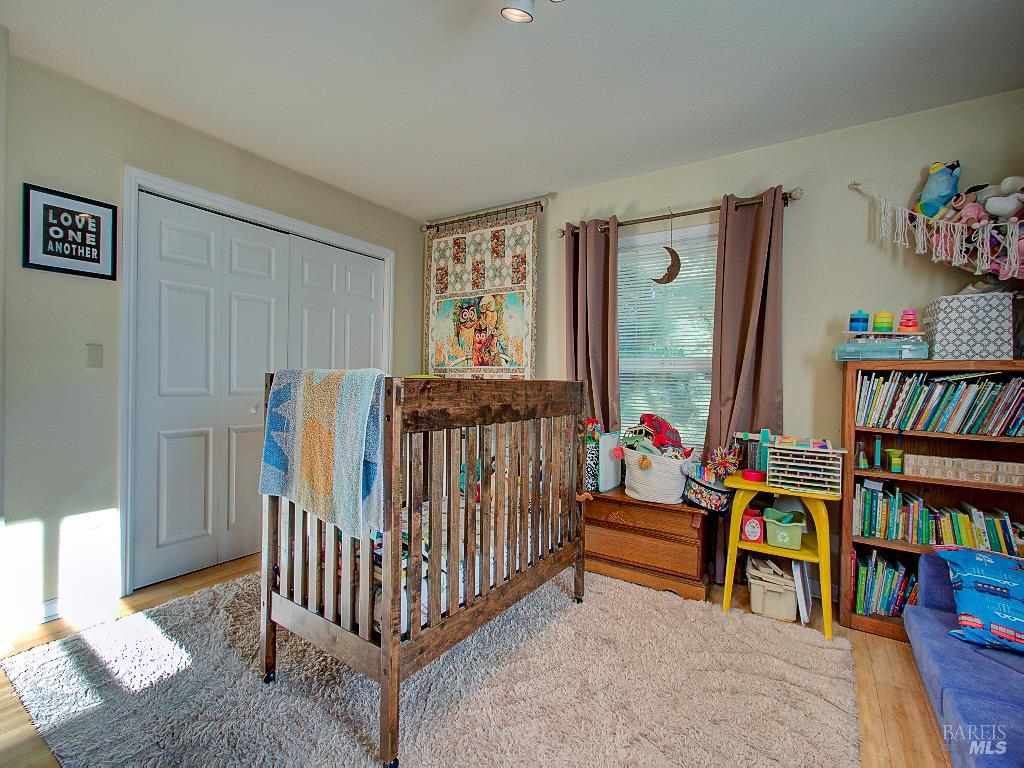 31191 Turner Road Fort Bragg, CA 95437 - Photo 26 of 36 a bedroom with furniture and a book shelf