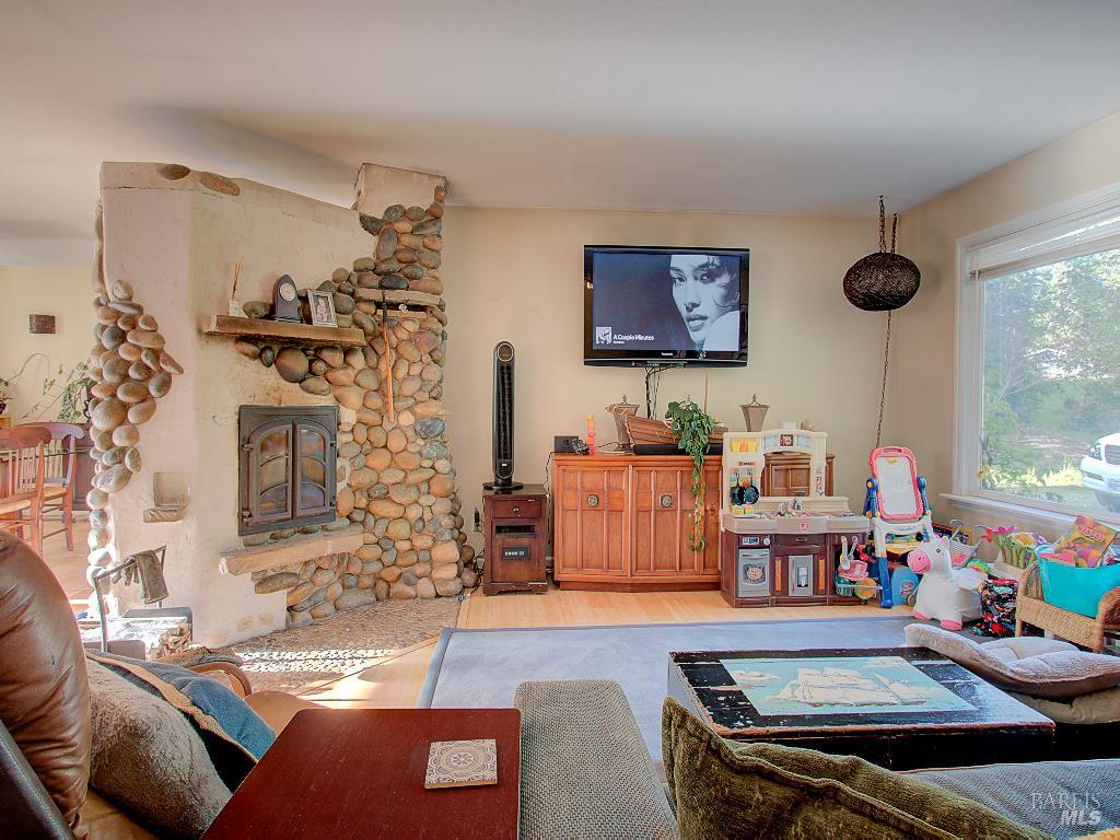 31191 Turner Road Fort Bragg, CA 95437 - Photo 3 of 36 a living room with furniture and a flat screen tv
