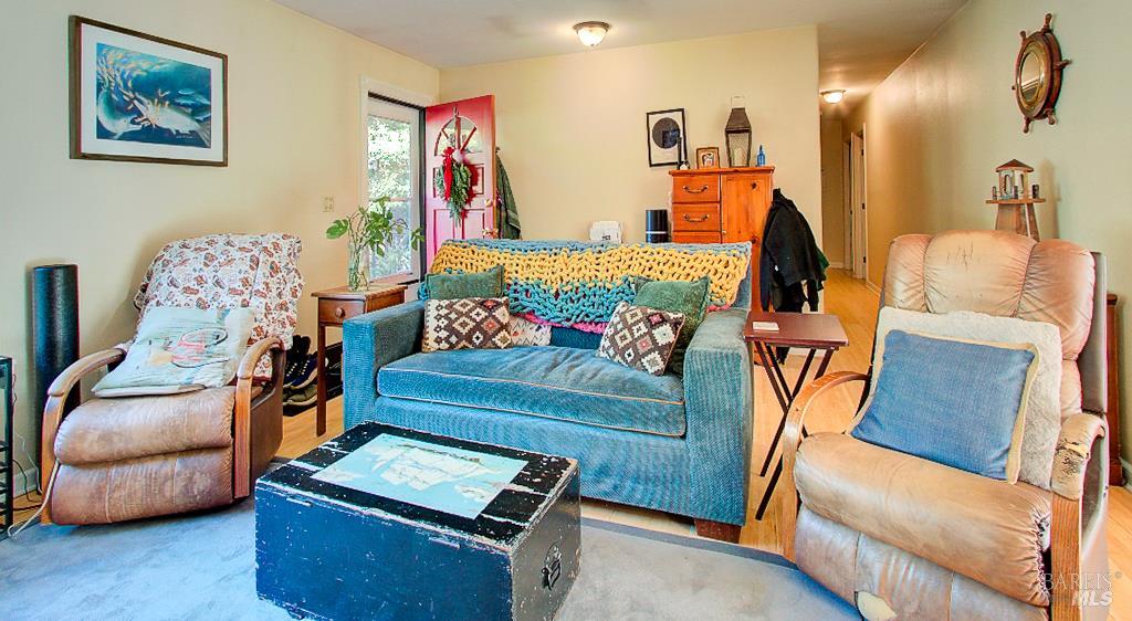 31191 Turner Road Fort Bragg, CA 95437 - Photo 5 of 36 a bedroom with furniture and a wooden floor