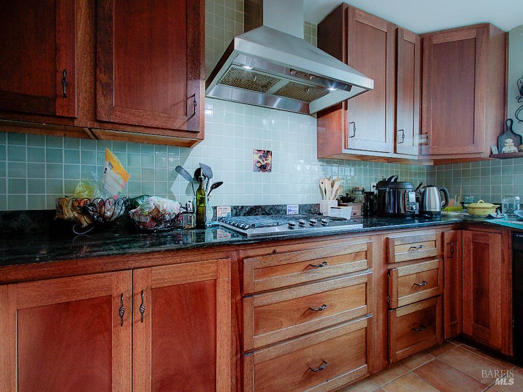 31191 Turner Road Fort Bragg, CA 95437 - Photo 8 of 36 a kitchen with stainless steel appliances granite countertop wooden cabinets and a counter top