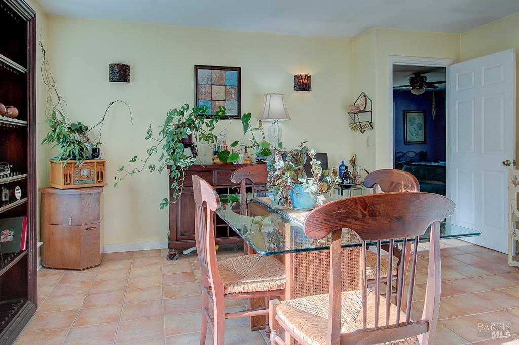 31191 Turner Road Fort Bragg, CA 95437 - Photo 10 of 36 a view of a dining room with furniture and a potted plant