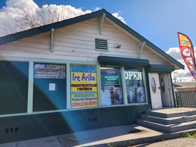 1902 East Harding Way Stockton, CA 95205 - Photo 5 of 6 a front view of a house with large windows