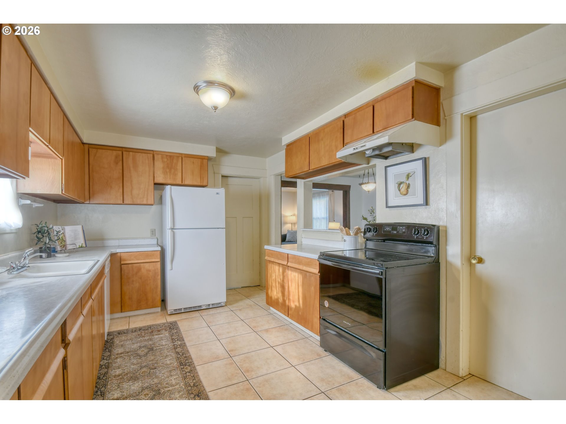 120 Southeast 7th Street Pendleton, OR 97801 - Photo 13 of 35 a kitchen with a stove a refrigerator and cabinets