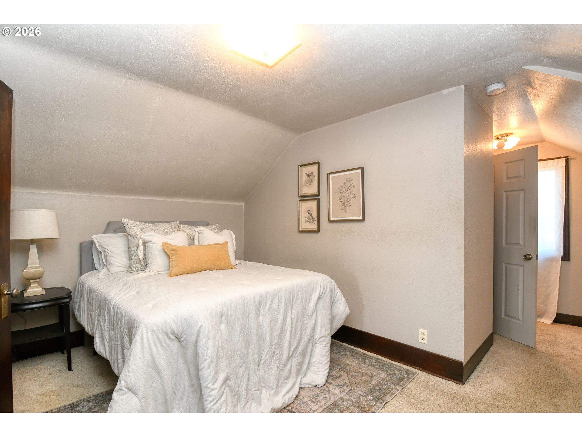 120 Southeast 7th Street Pendleton, OR 97801 - Photo 21 of 35 a bedroom with a bed and a night stand