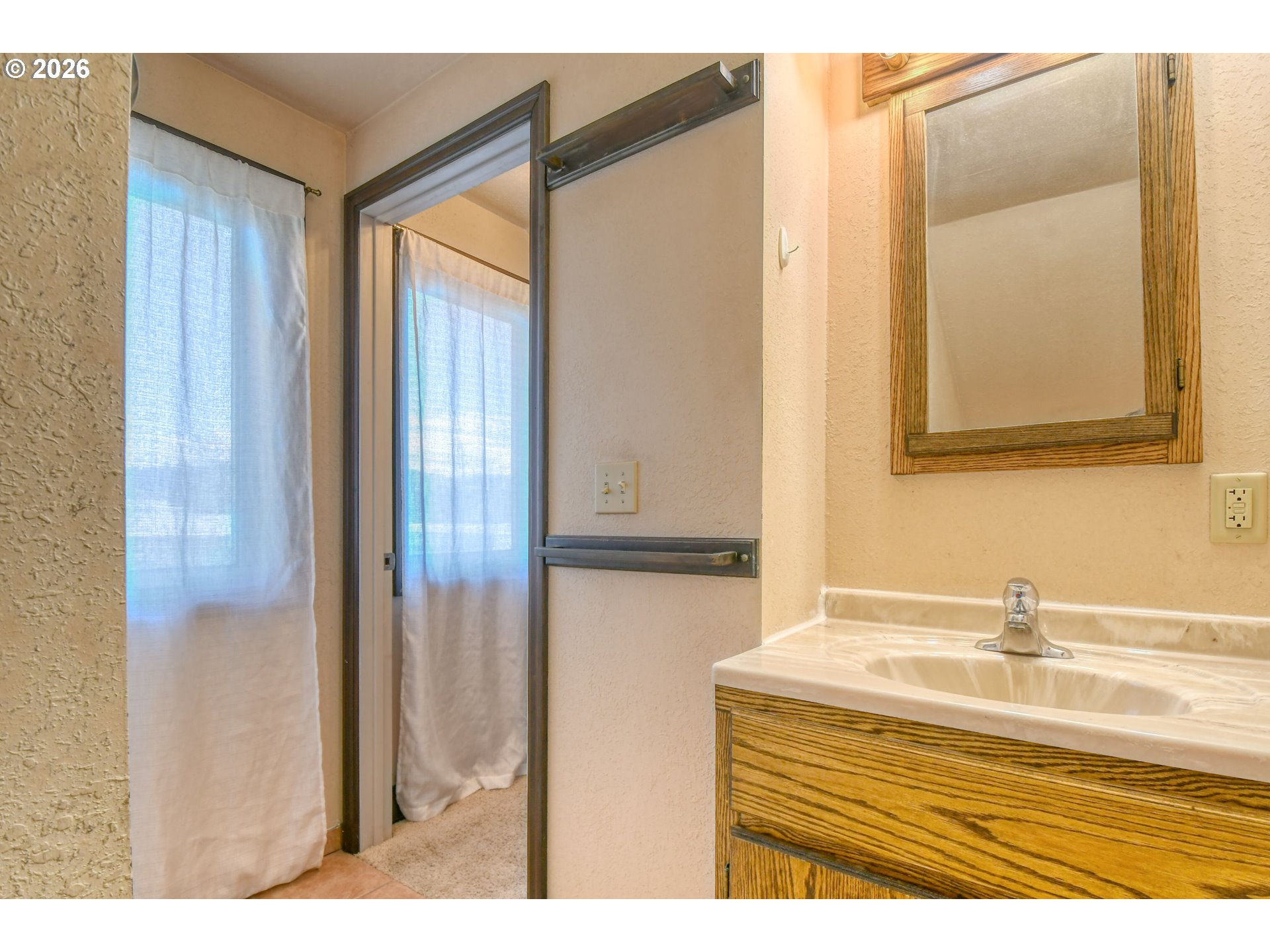 120 Southeast 7th Street Pendleton, OR 97801 - Photo 24 of 35 a bathroom with a sink and a mirror