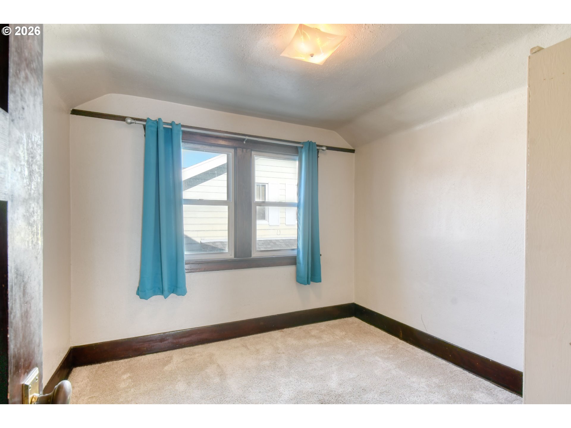 120 Southeast 7th Street Pendleton, OR 97801 - Photo 28 of 35 a view of an empty room with wooden floor and a window