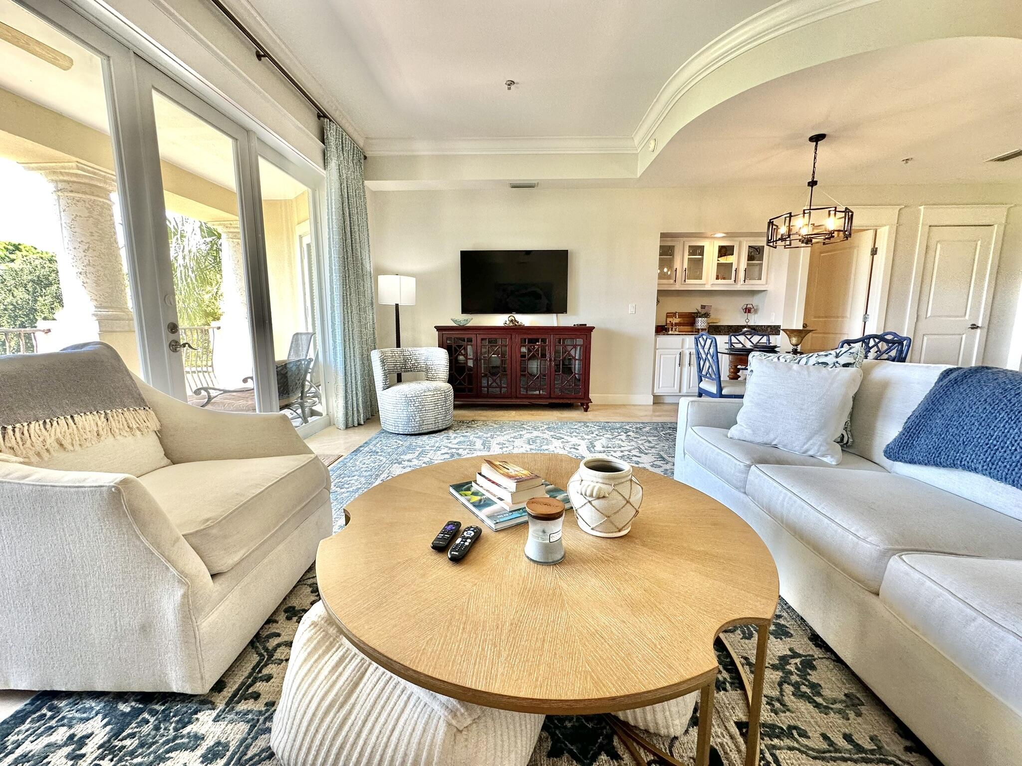 5353 Pine Ridge Lane, Unit 5353 Miramar Beach, FL 32550 - Photo 21 of 62 a living room with furniture and a flat screen tv