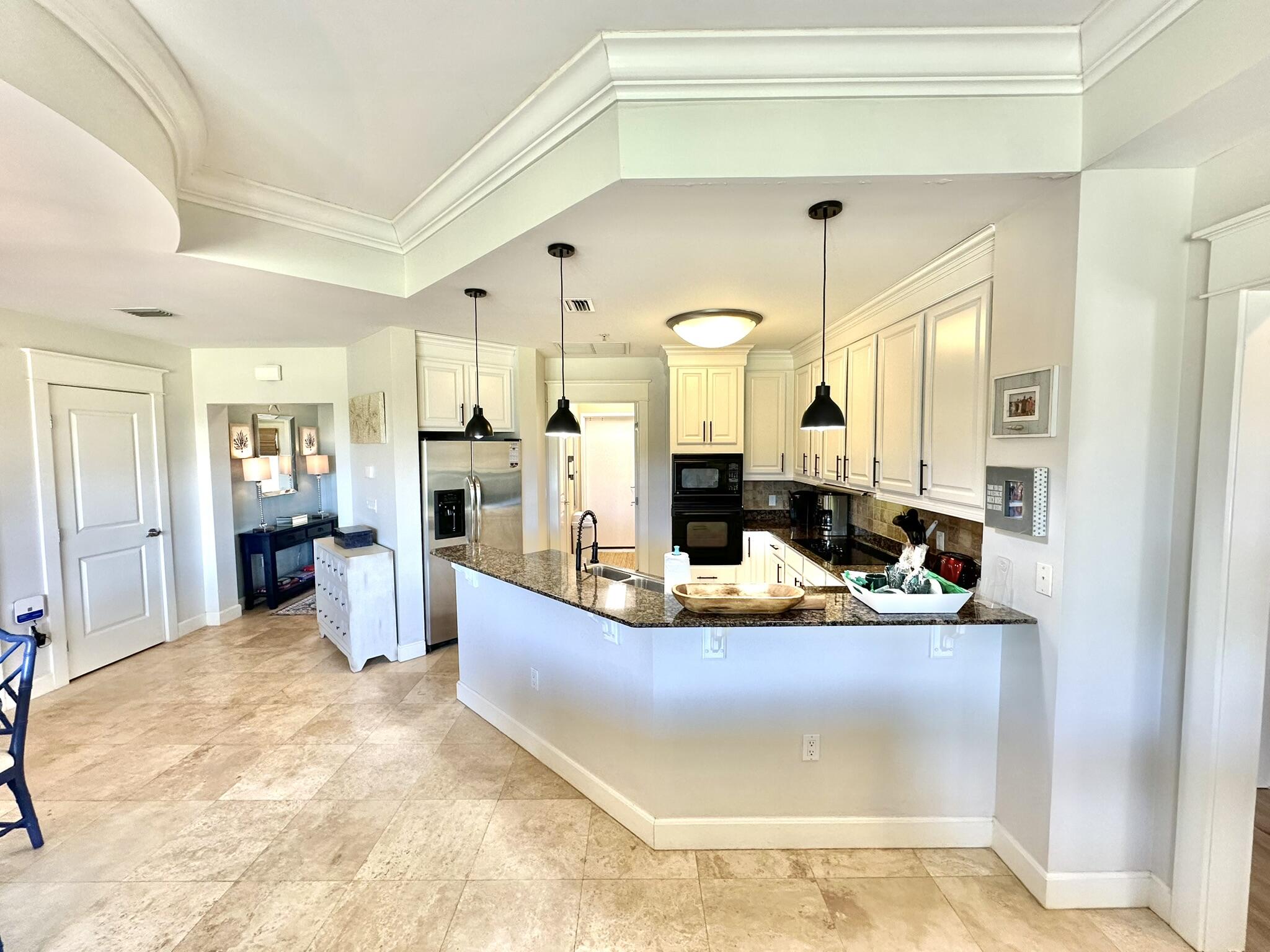 5353 Pine Ridge Lane, Unit 5353 Miramar Beach, FL 32550 - Photo 22 of 62 a living room with stainless steel appliances kitchen island granite countertop furniture and a view of kitchen