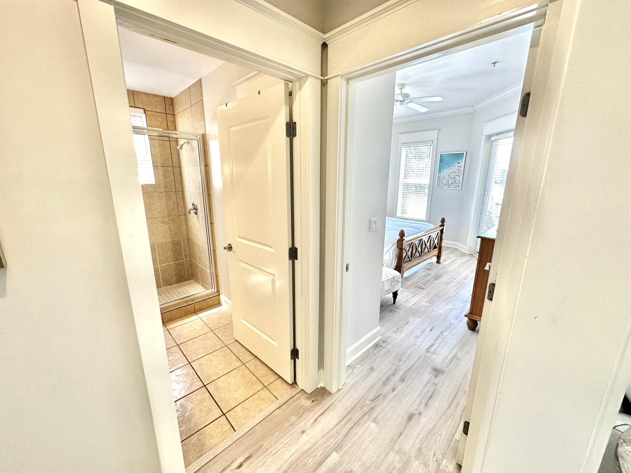 5353 Pine Ridge Lane, Unit 5353 Miramar Beach, FL 32550 - Photo 25 of 62 a bathroom with a glass shower door