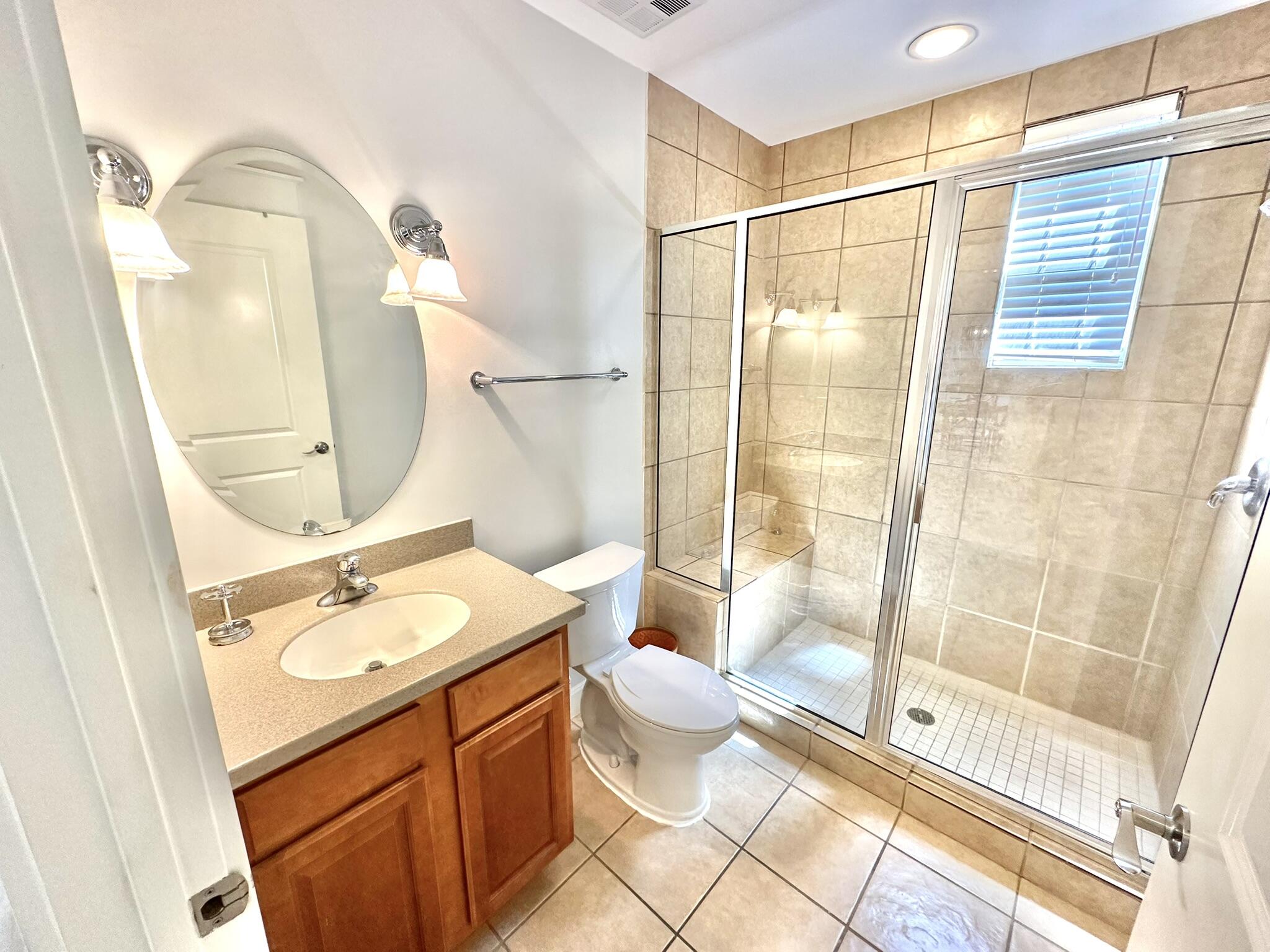 5353 Pine Ridge Lane, Unit 5353 Miramar Beach, FL 32550 - Photo 26 of 62 a bathroom with a granite countertop sink toilet and shower