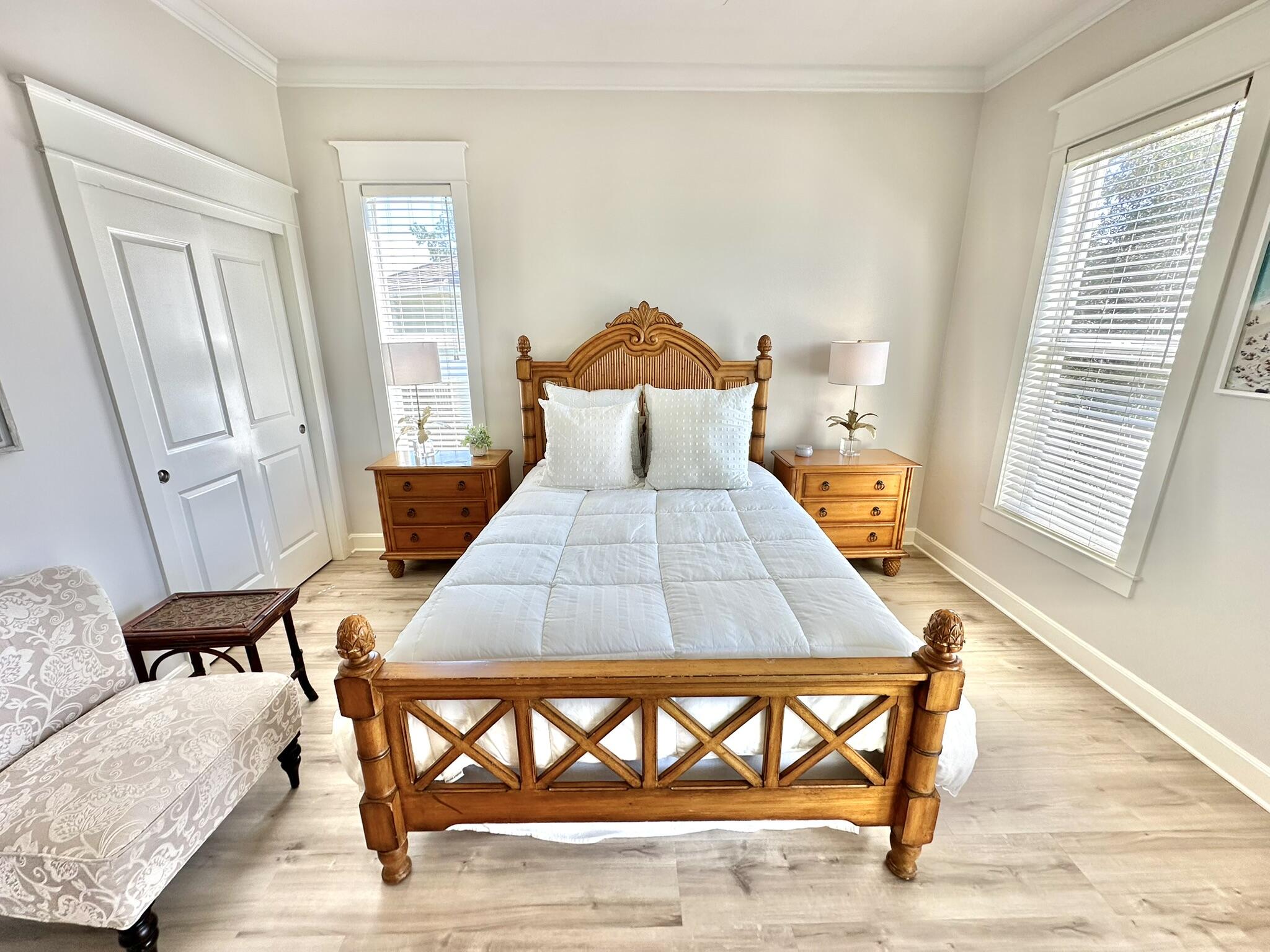 5353 Pine Ridge Lane, Unit 5353 Miramar Beach, FL 32550 - Photo 28 of 62 a bedroom with a bed and a wooden floor