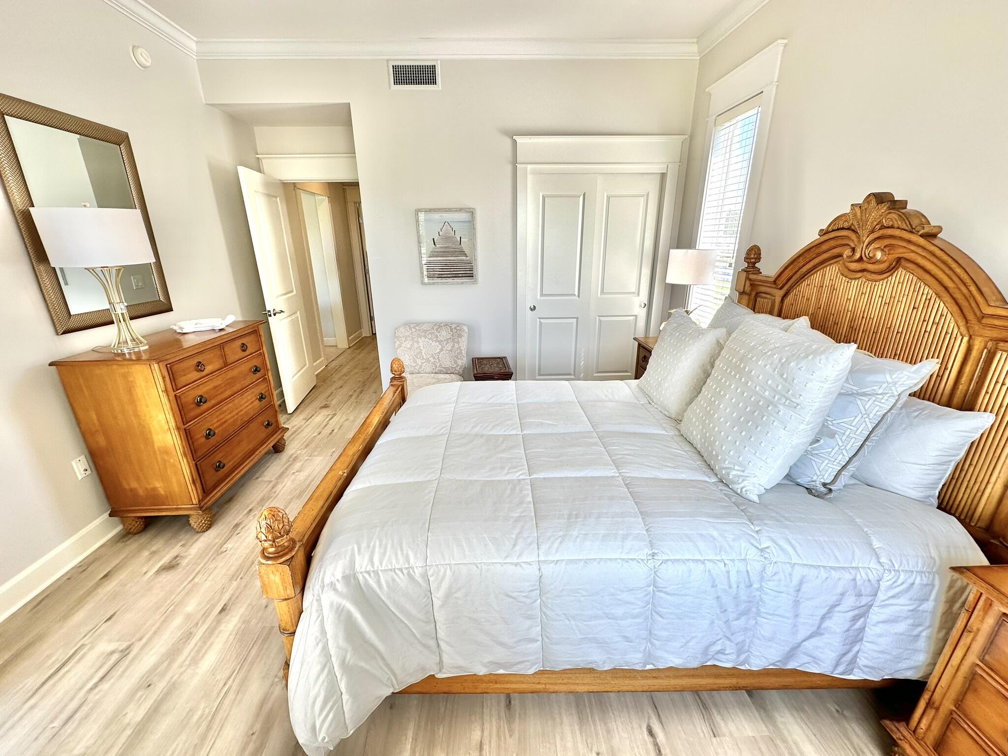 5353 Pine Ridge Lane, Unit 5353 Miramar Beach, FL 32550 - Photo 29 of 62 a bedroom with a bed and wooden floor
