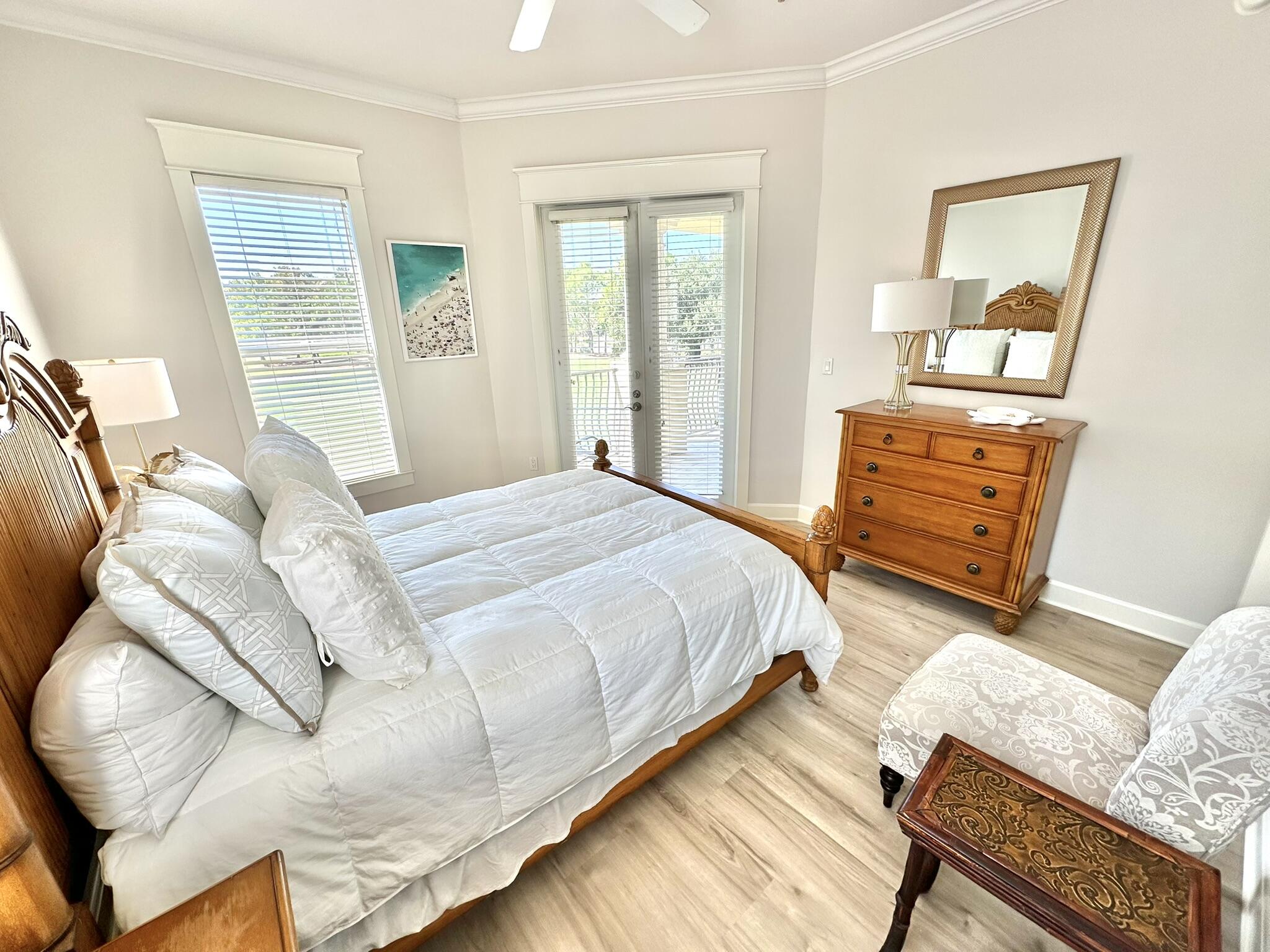 5353 Pine Ridge Lane, Unit 5353 Miramar Beach, FL 32550 - Photo 31 of 62 a bedroom with a bed and wooden floor