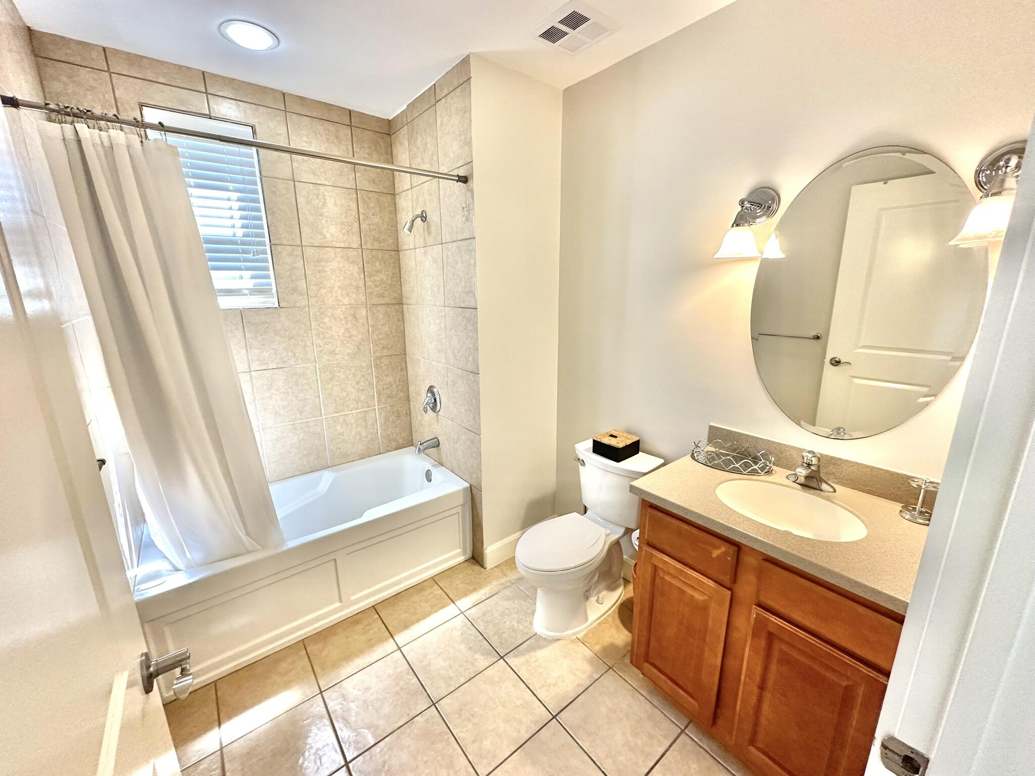 5353 Pine Ridge Lane, Unit 5353 Miramar Beach, FL 32550 - Photo 33 of 62 a bathroom with a double vanity sink toilet mirror and shower
