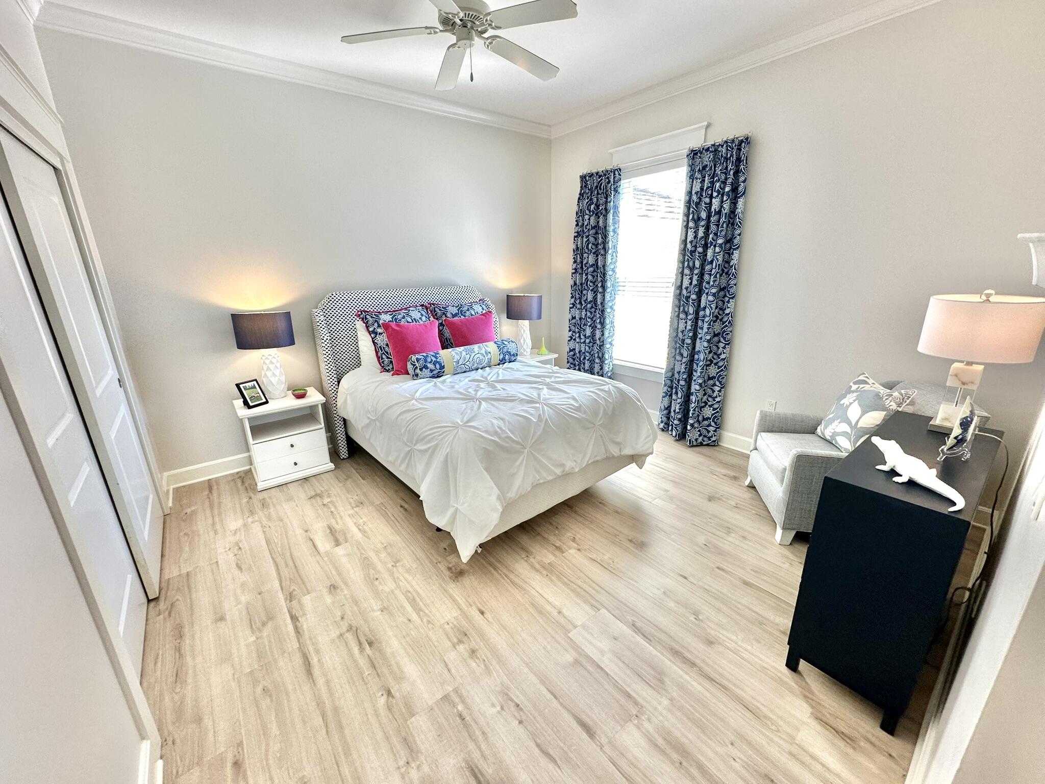 5353 Pine Ridge Lane, Unit 5353 Miramar Beach, FL 32550 - Photo 34 of 62 a bedroom with a bed and wooden floor