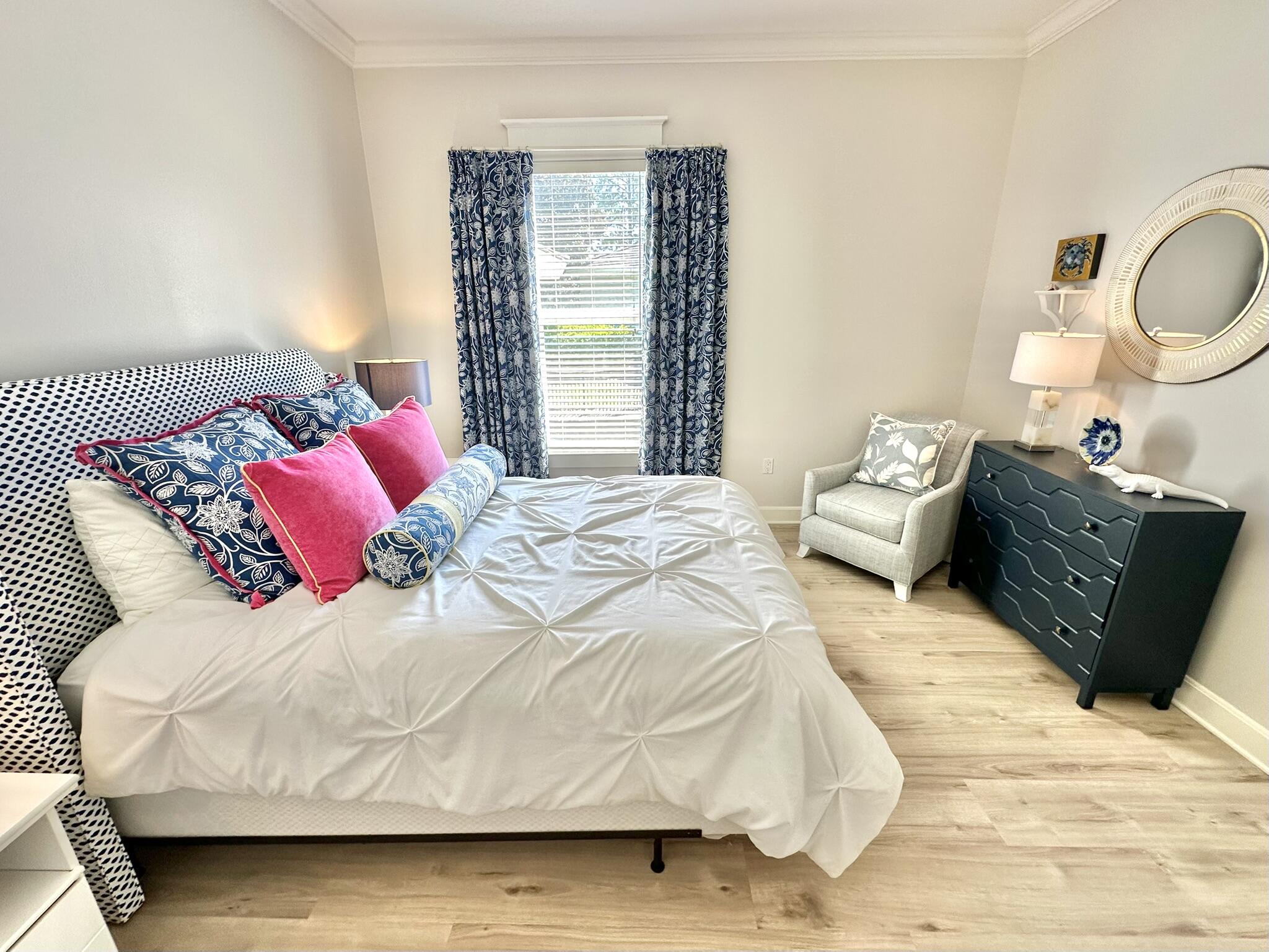 5353 Pine Ridge Lane, Unit 5353 Miramar Beach, FL 32550 - Photo 37 of 62 a bed sitting in a bedroom next to a window and dresser