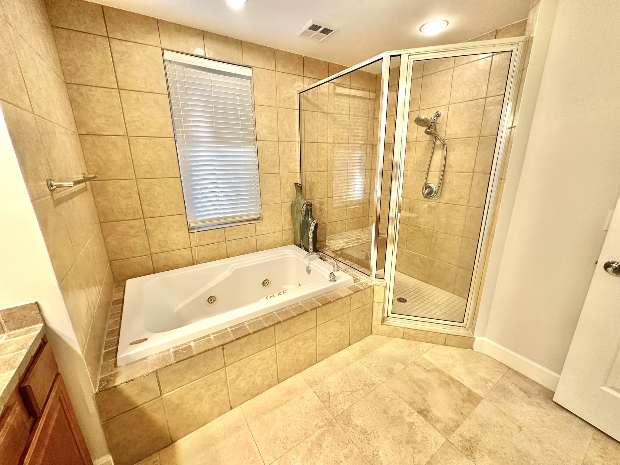 5353 Pine Ridge Lane, Unit 5353 Miramar Beach, FL 32550 - Photo 42 of 62 a bathroom with a bathtub and a shower