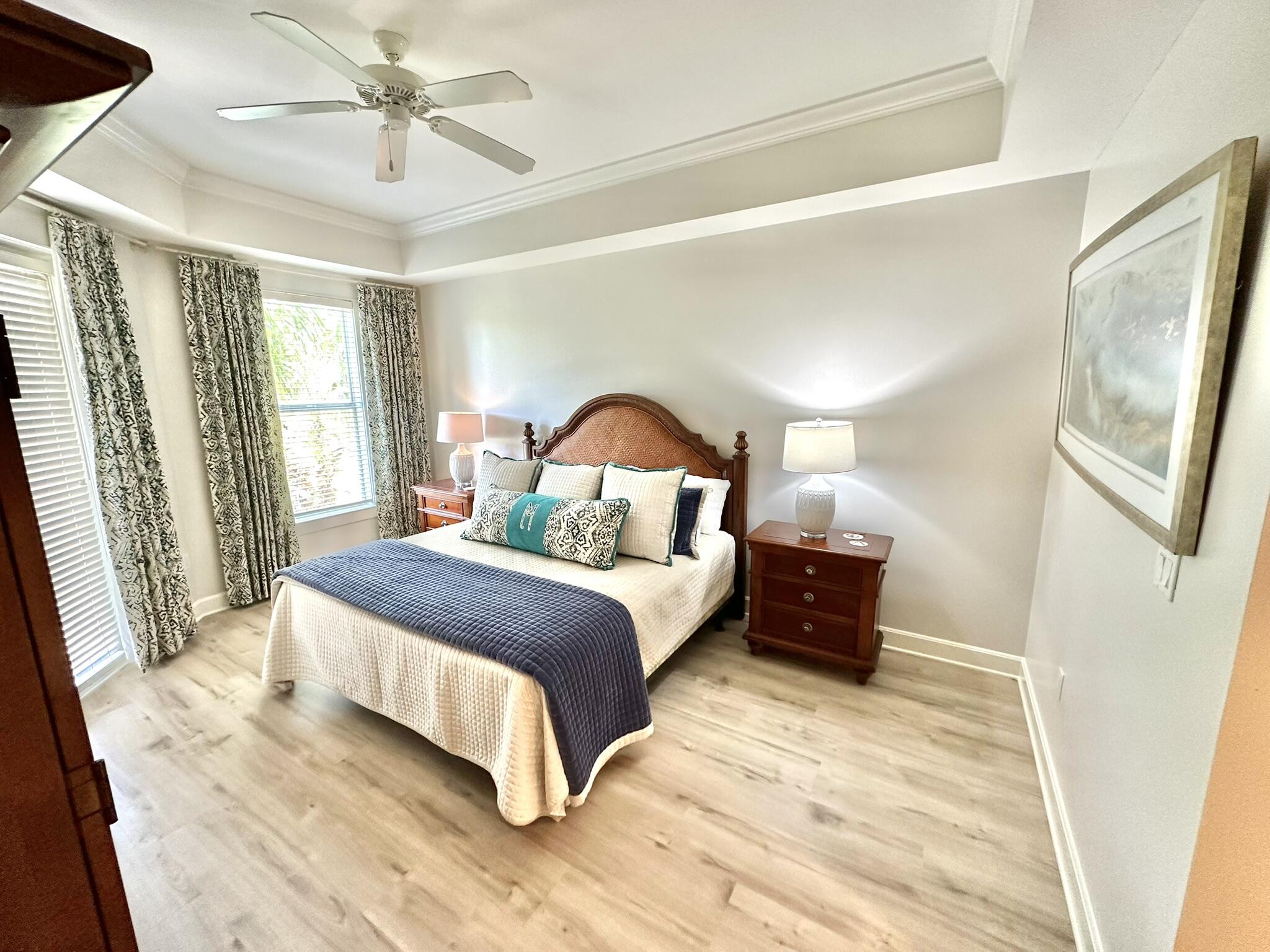 5353 Pine Ridge Lane, Unit 5353 Miramar Beach, FL 32550 - Photo 44 of 62 a bedroom with a bed lamp on dresser and a window