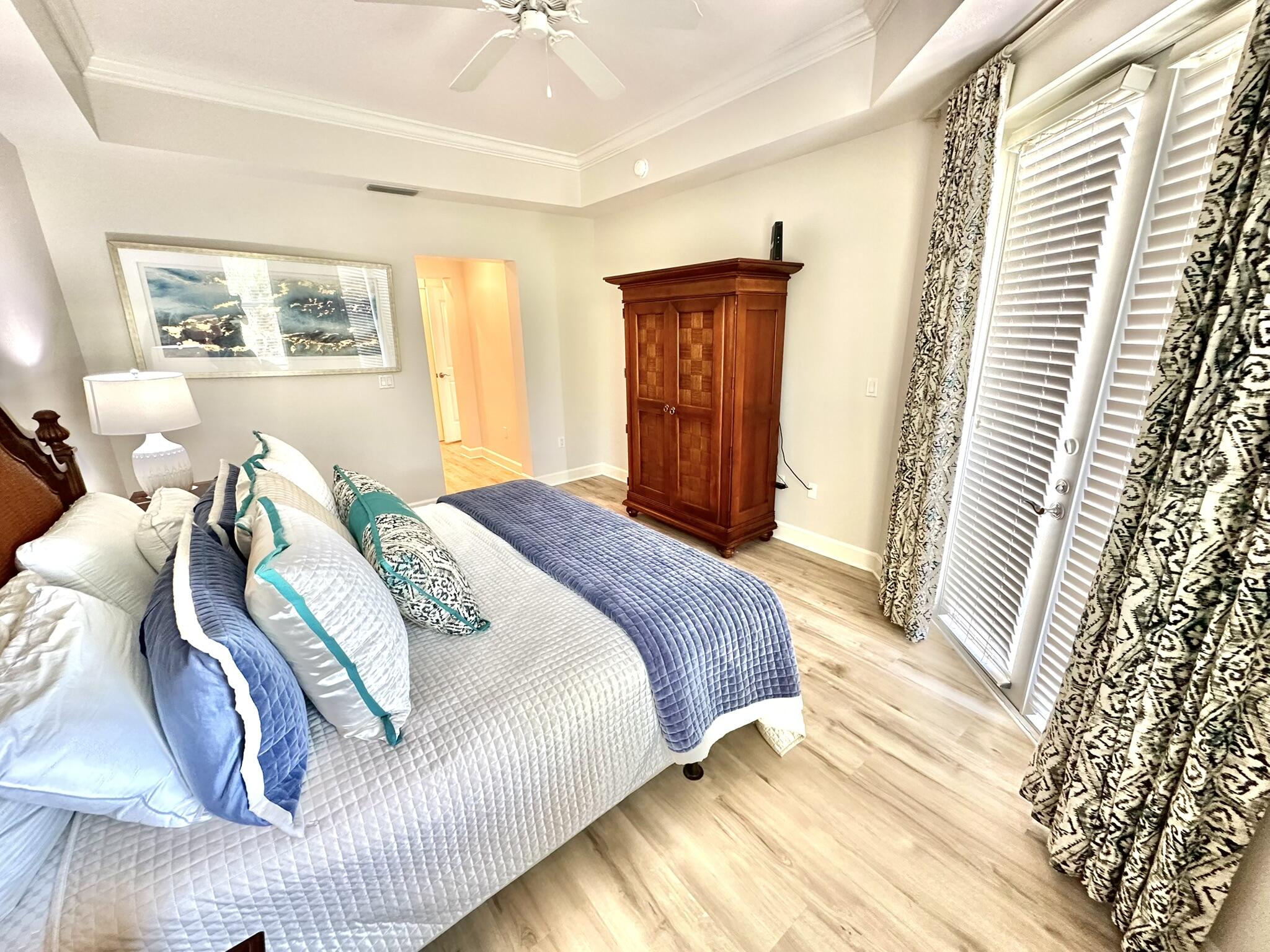 5353 Pine Ridge Lane, Unit 5353 Miramar Beach, FL 32550 - Photo 47 of 62 a spacious bedroom with a bed and a window