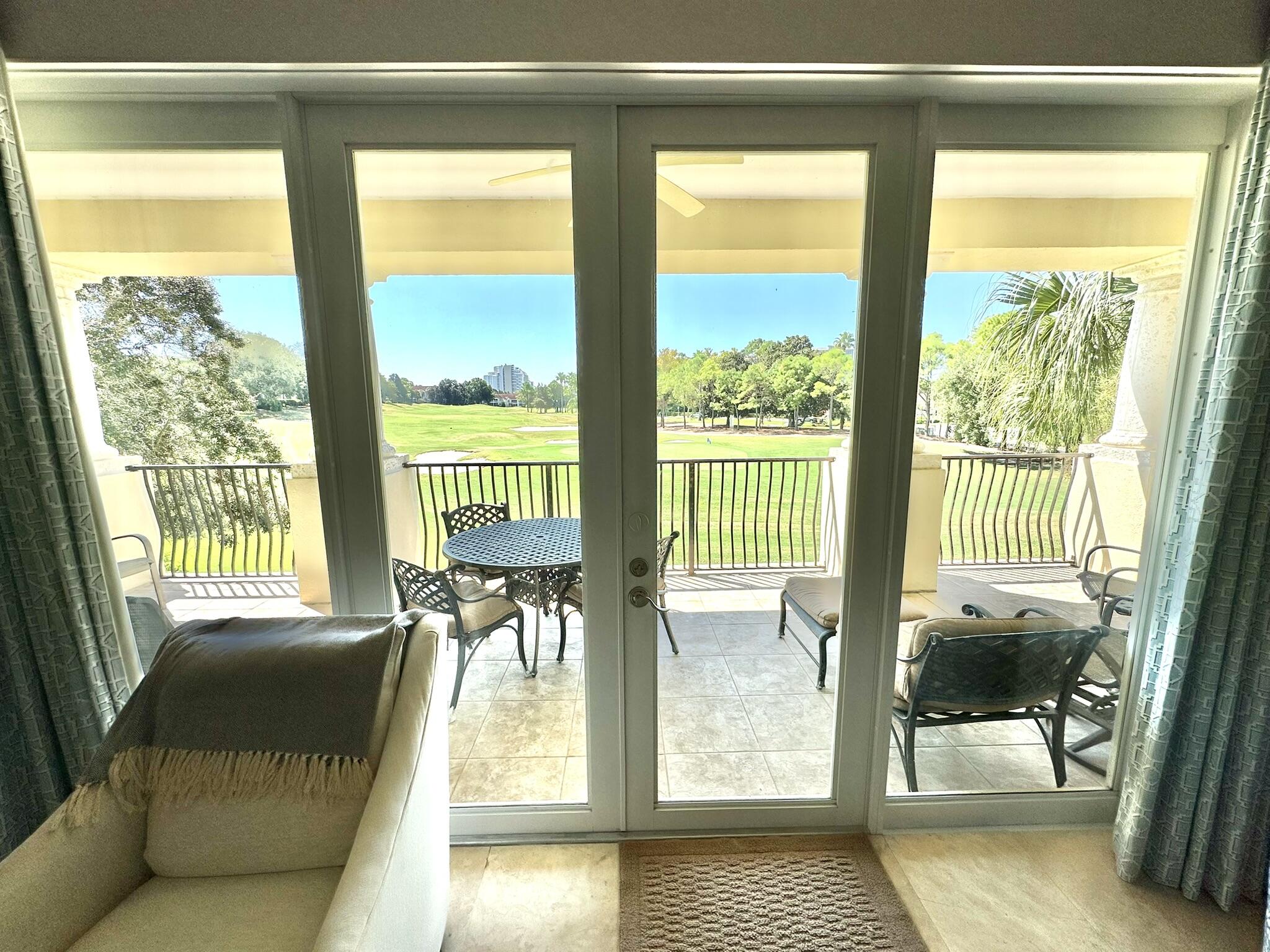 5353 Pine Ridge Lane, Unit 5353 Miramar Beach, FL 32550 - Photo 48 of 62 a living room with furniture and a floor to ceiling window