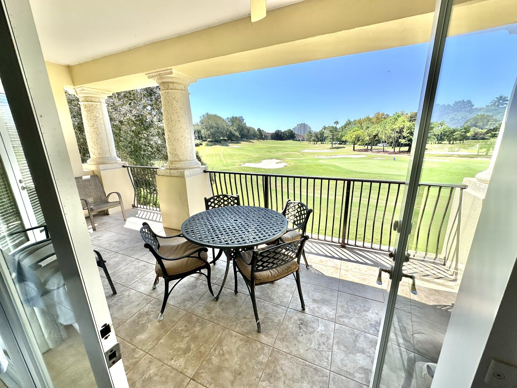 5353 Pine Ridge Lane, Unit 5353 Miramar Beach, FL 32550 - Photo 49 of 62 a view of a chairs and table in patio