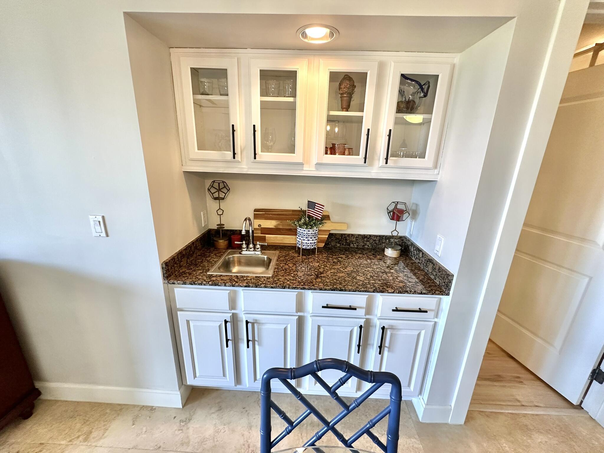 5353 Pine Ridge Lane, Unit 5353 Miramar Beach, FL 32550 - Photo 9 of 62 a kitchen with a stove a sink and a refrigerator