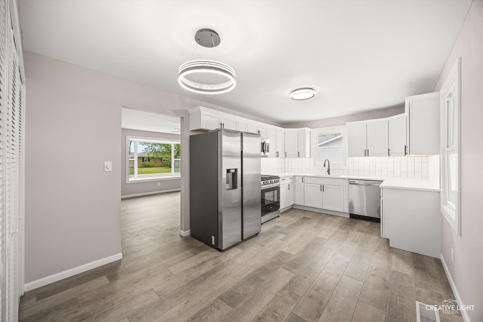 286 South Barbara Drive Kankakee, IL 60901 - Photo 5 of 18 a kitchen with stainless steel appliances a sink cabinets and wooden floor