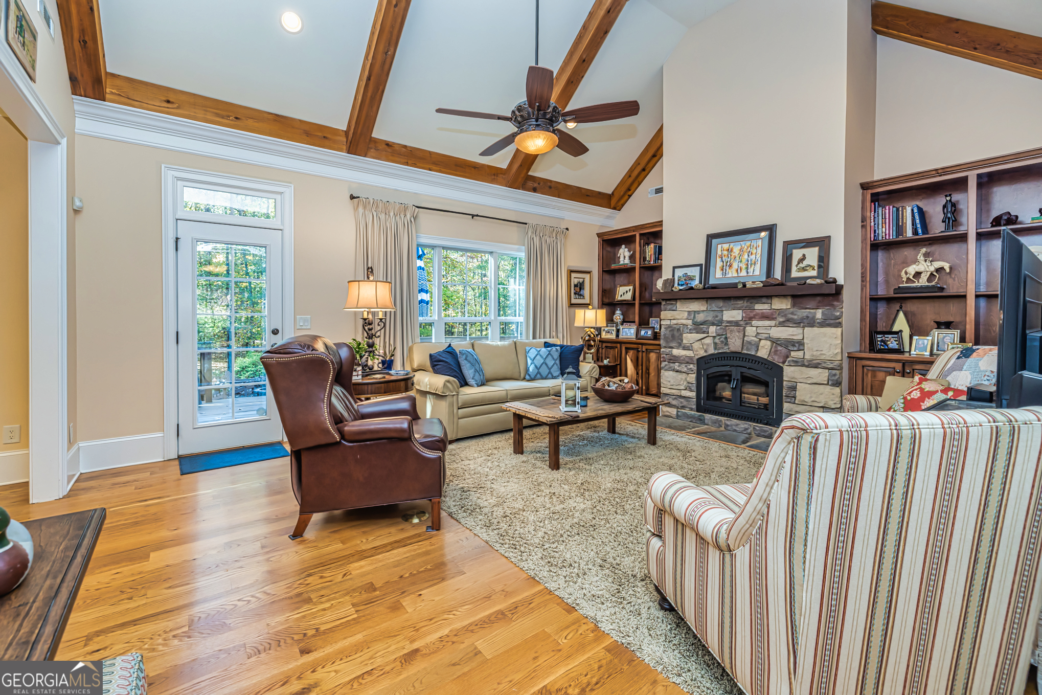 210 Mockingbird Lane Brooks, GA 30205 - Photo 18 of 87 a living room with furniture and a fireplace