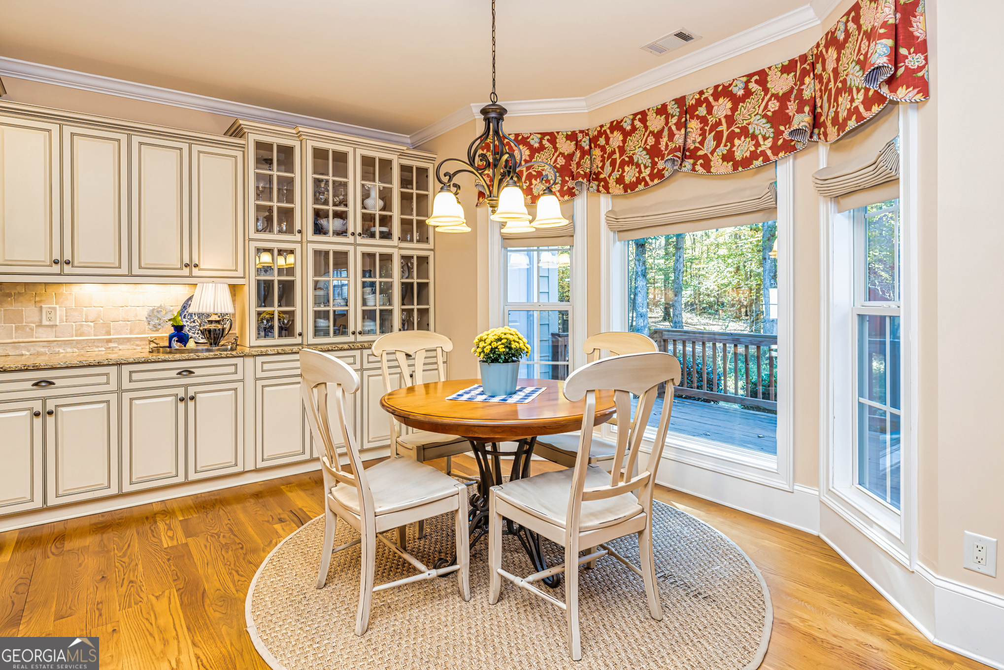 210 Mockingbird Lane Brooks, GA 30205 - Photo 21 of 87 a dining room with furniture a chandelier and wooden floor