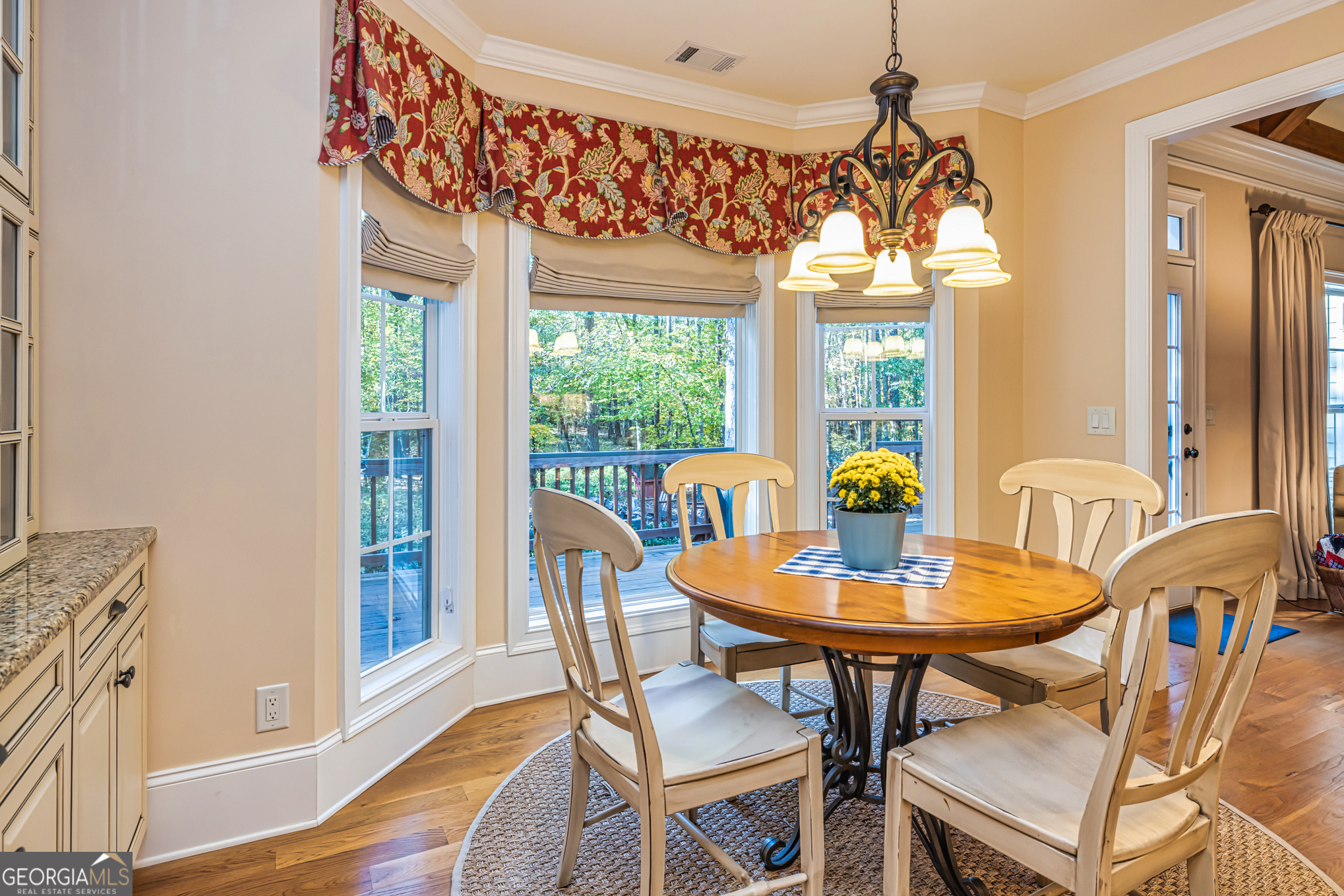 210 Mockingbird Lane Brooks, GA 30205 - Photo 22 of 87 a view of a dining room with furniture a chandelier and wooden floor