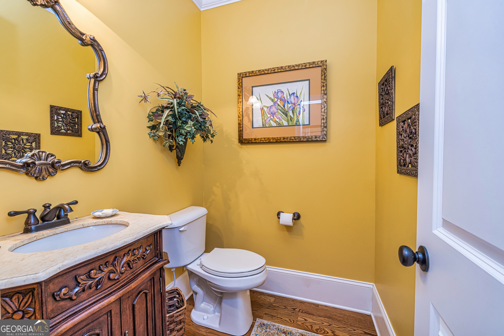 210 Mockingbird Lane Brooks, GA 30205 - Photo 26 of 87 a bathroom with a sink a toilet and mirror