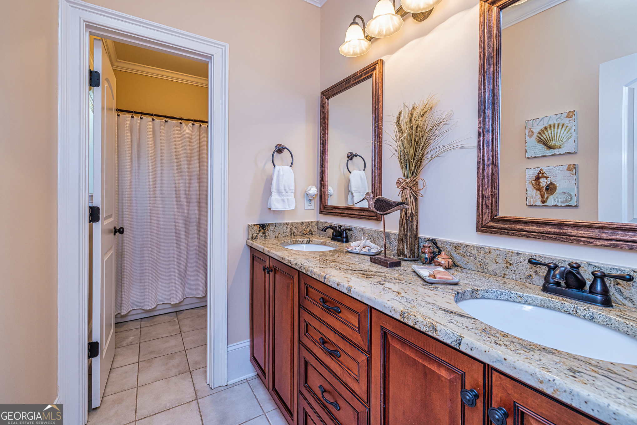 210 Mockingbird Lane Brooks, GA 30205 - Photo 28 of 87 a bathroom with a granite countertop sink and a mirror