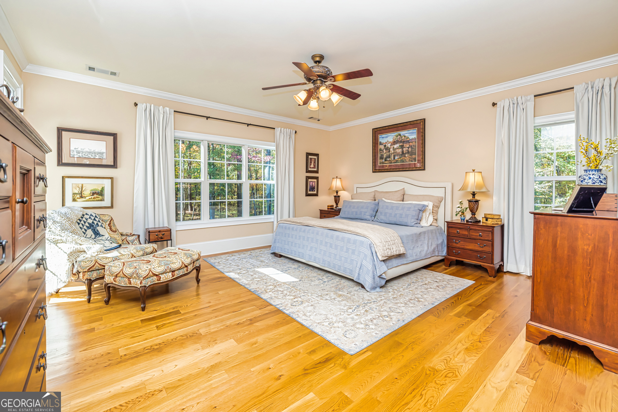 210 Mockingbird Lane Brooks, GA 30205 - Photo 31 of 87 a spacious bedroom with a bed and wooden floor