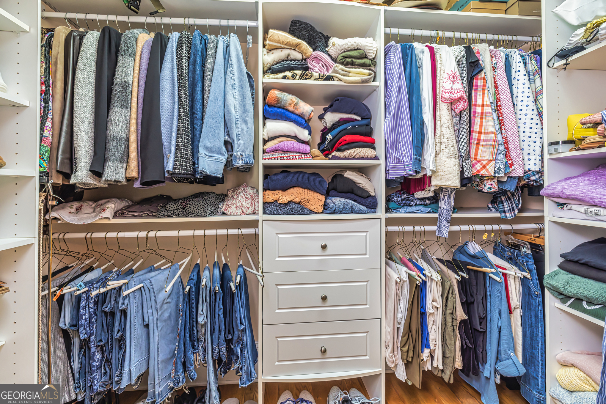 210 Mockingbird Lane Brooks, GA 30205 - Photo 36 of 87 a view of walk in closet with clothes and shoes