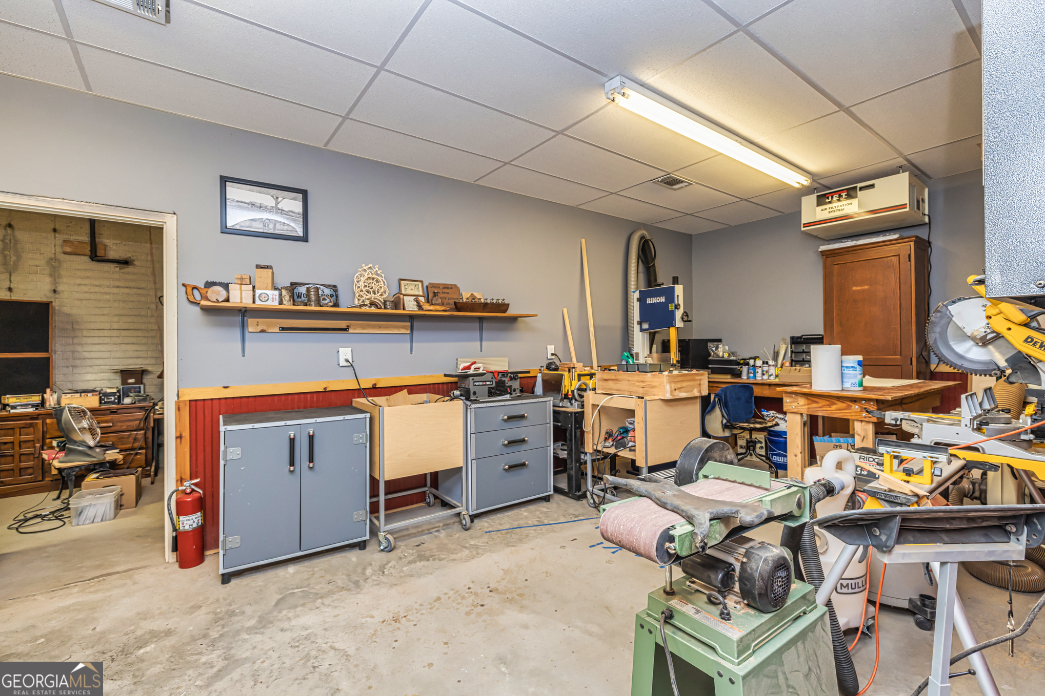 210 Mockingbird Lane Brooks, GA 30205 - Photo 44 of 87 a room with furniture a rug kitchen view and a chair