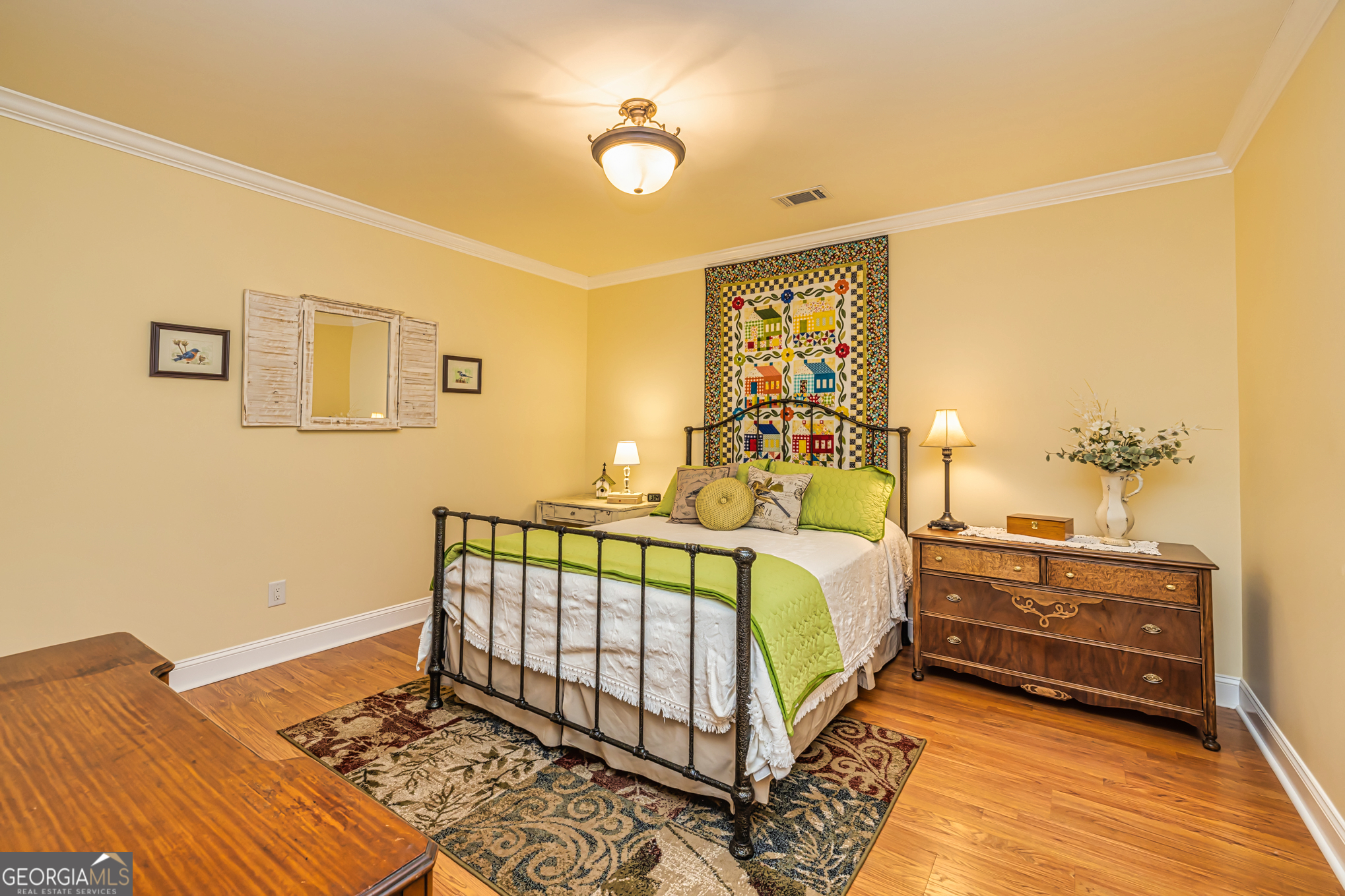 210 Mockingbird Lane Brooks, GA 30205 - Photo 48 of 87 a bedroom with a bed and a chandelier