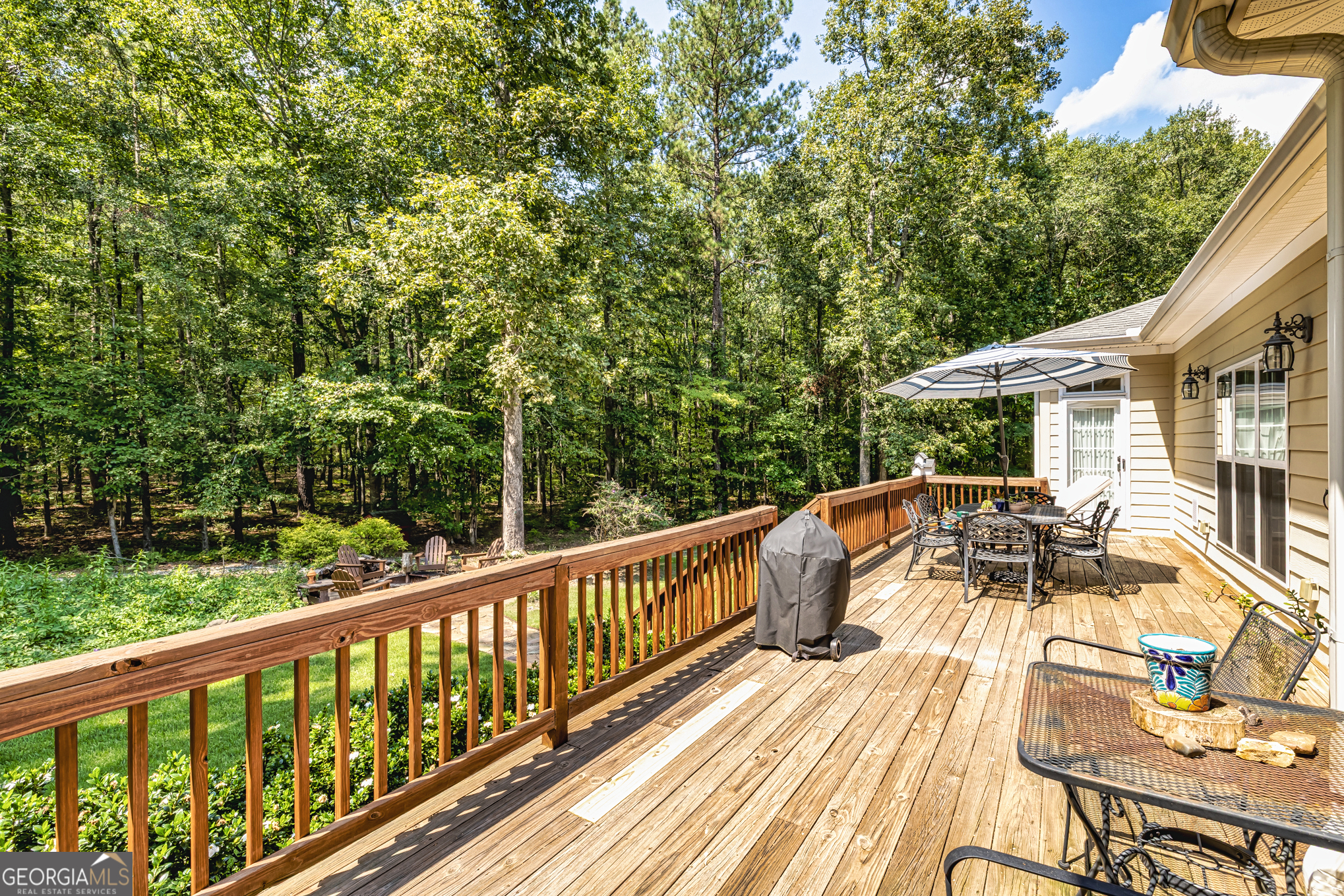 210 Mockingbird Lane Brooks, GA 30205 - Photo 62 of 87 a view of balcony with furniture and wooden floor