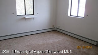 1000 County Road 252 Rifle, CO 81650 - Photo 14 of 22 an empty room with a window