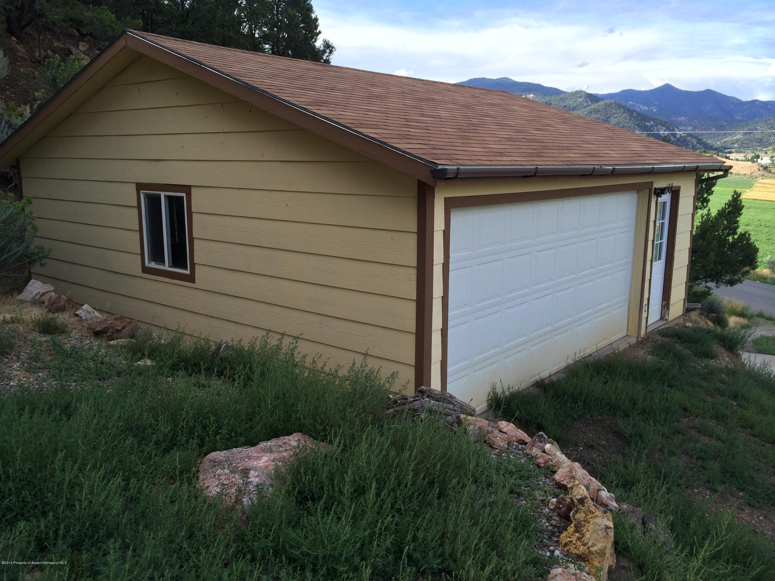 1000 County Road 252 Rifle, CO 81650 - Photo 18 of 22 a view of a house with a yard