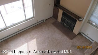 1000 County Road 252 Rifle, CO 81650 - Photo 6 of 22 a view of an empty room with a window