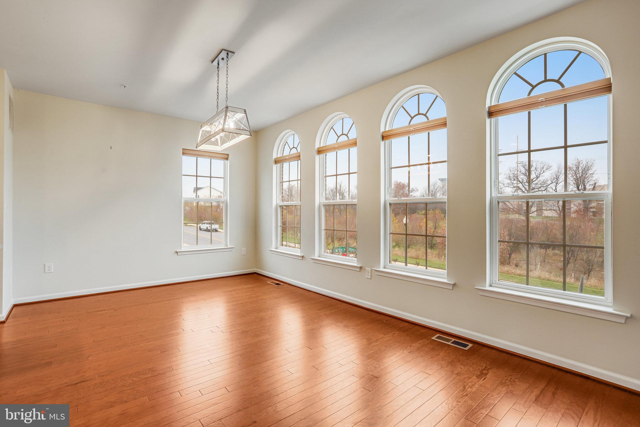 5918 Jefferson Commons Way Frederick, MD 21703 - Photo 19 of 39 a view of an entryway with wooden floor and windows