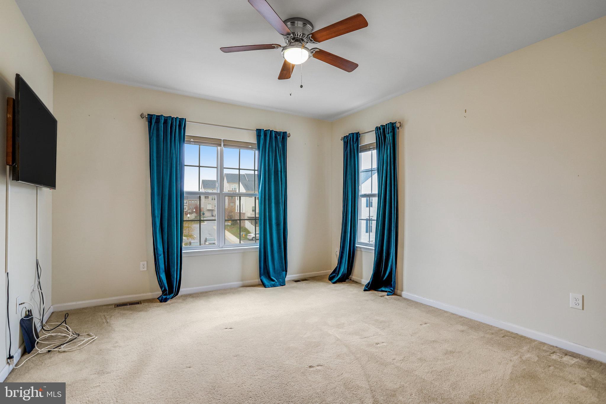 5918 Jefferson Commons Way Frederick, MD 21703 - Photo 22 of 39 a view of an empty room with a window and a kitchen