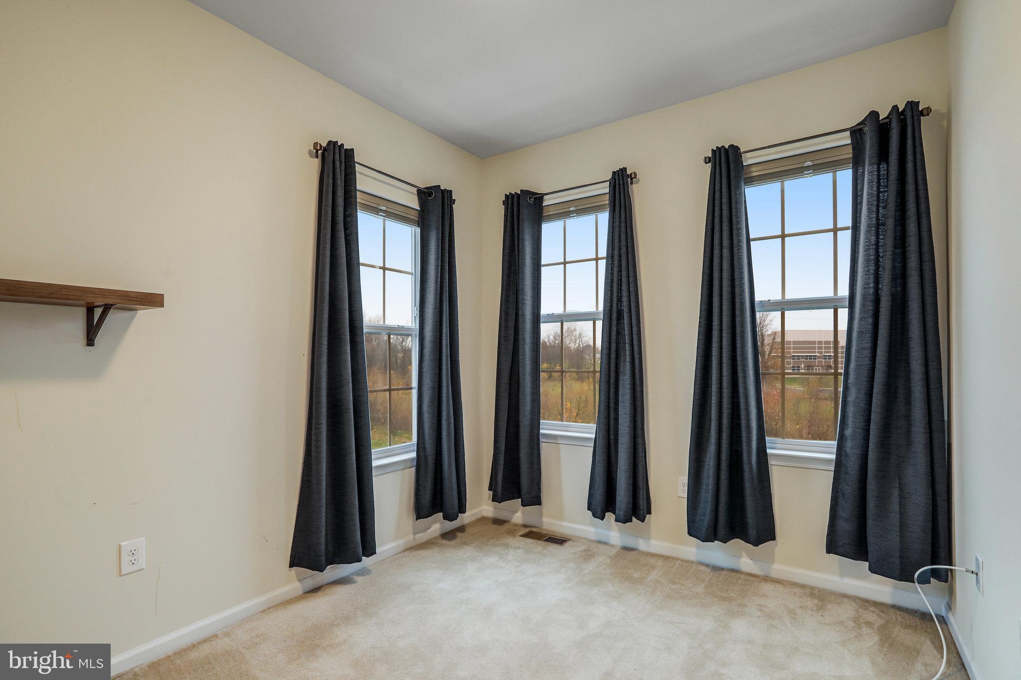 5918 Jefferson Commons Way Frederick, MD 21703 - Photo 27 of 39 an empty room with windows