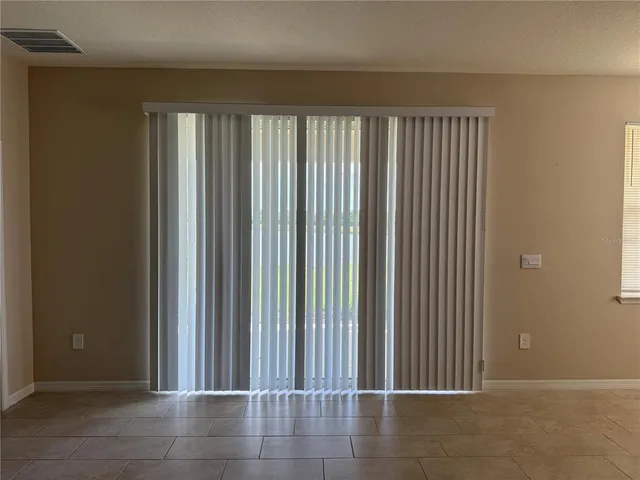 a view of a hallway with wooden shelves