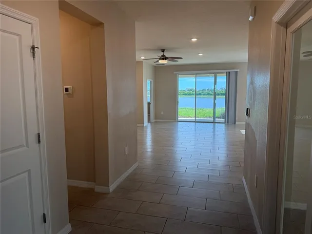 a view of a bathroom with a glass door and a sink