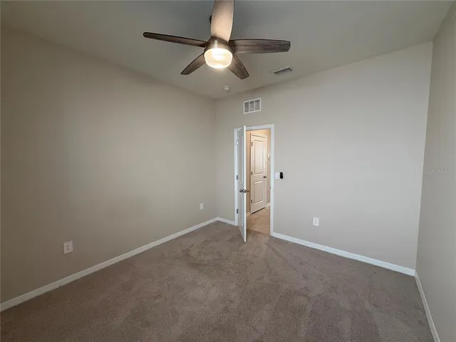 a view of a bathroom from a hallway