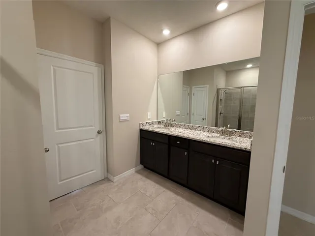 a view of a lake with houses in the back